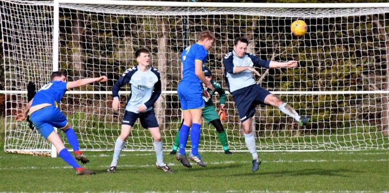 Action from the game between Wick and AEK Boco. Wick are in the darker blue. Picture, Pete Langley.