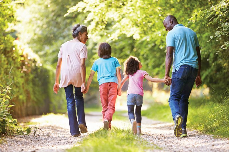 Family children grandparents walking in countryside happy smiling