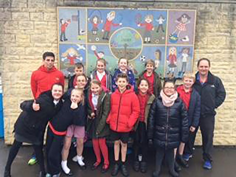 Darcy Howchin, fifth from right, with some of her Bishop’s Cleeve Primary School friends ahead of their two-mile sponsored swim on Sunday