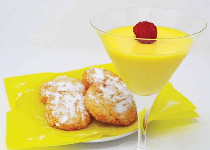 Refreshing citrus posset served with lemon and almond bites