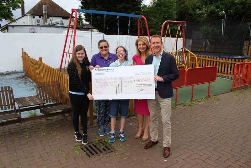 Steve Jones and Wendy Worger present a cheque to The Spring Centre