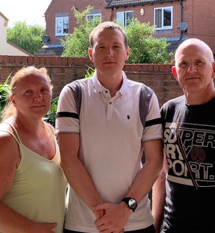 Aaron Powick with his mum and dad, Carolyn and Graham