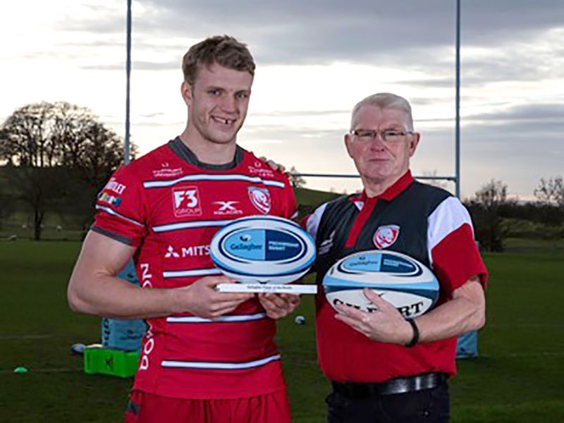 Ollie Thorley is presented with his award by Ron Etheridge