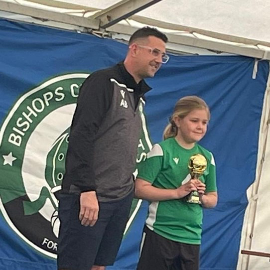 Mabel Murphy with Cleeve Colts coach Adam Barnett