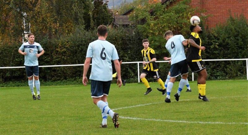 Action from the County League game between Gala Wilton and AEK Boco. Gala in yellow and black