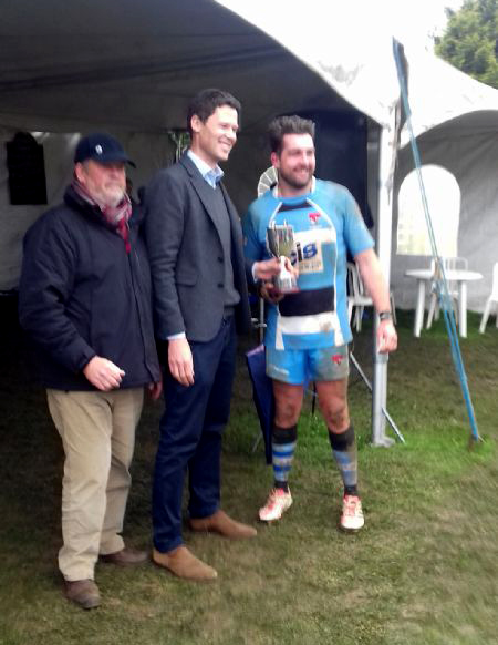 Cheltenham captain Rich Athey receives the Cheltenham Combination Senior Cup in April last year from Alex Chalk. Also pictured is Cheltenham Combination stalwart Malcolm Kedward