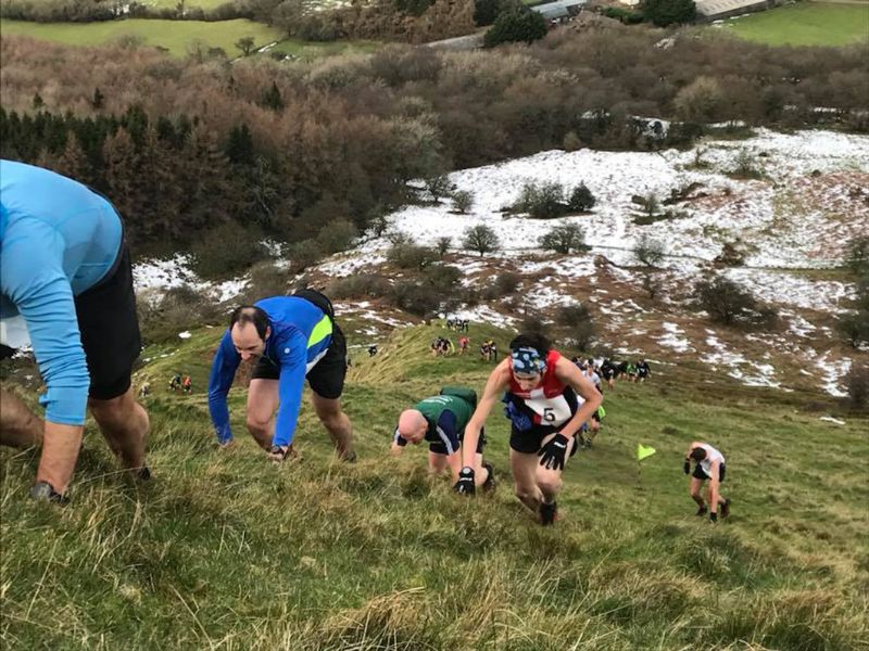 James Thomas in the Skirrid Fell Race, in the red vest. Look closely and you can just make out his wife Liz in the red vest at the bottom of the hill