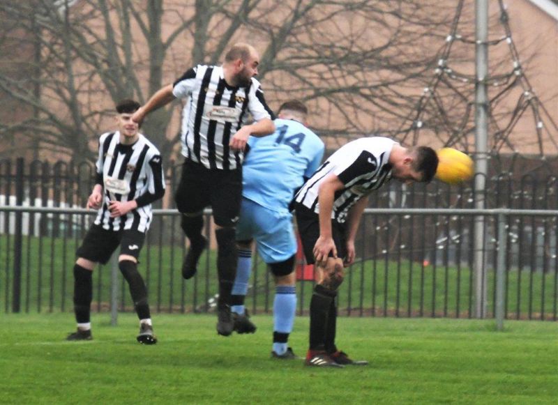 Action from Patchway Town, in black and white, against Henbury