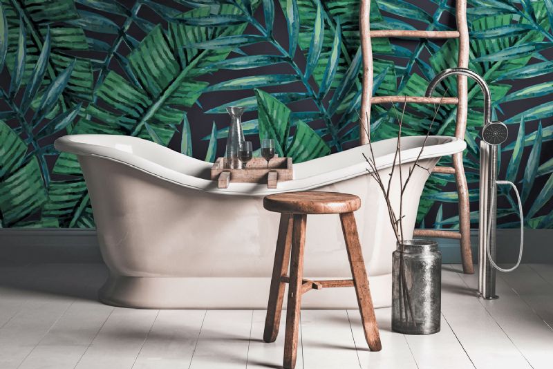 Bath in bathroom with green jungle wallpaper Wallsauce