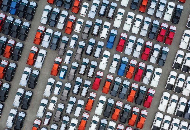 Lots of cars lined up ready to be transported